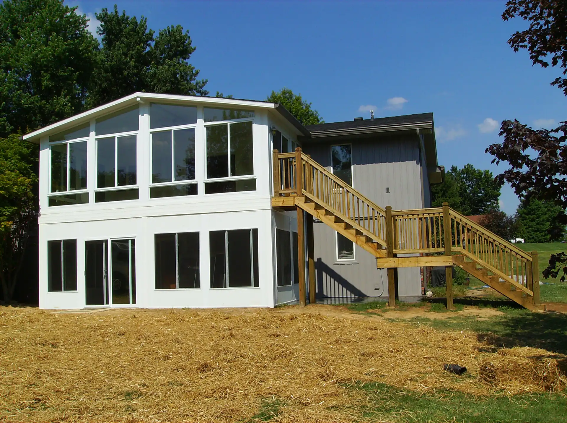 Jimmy-Carter-After-scaled upper and lower sunroom with stairs