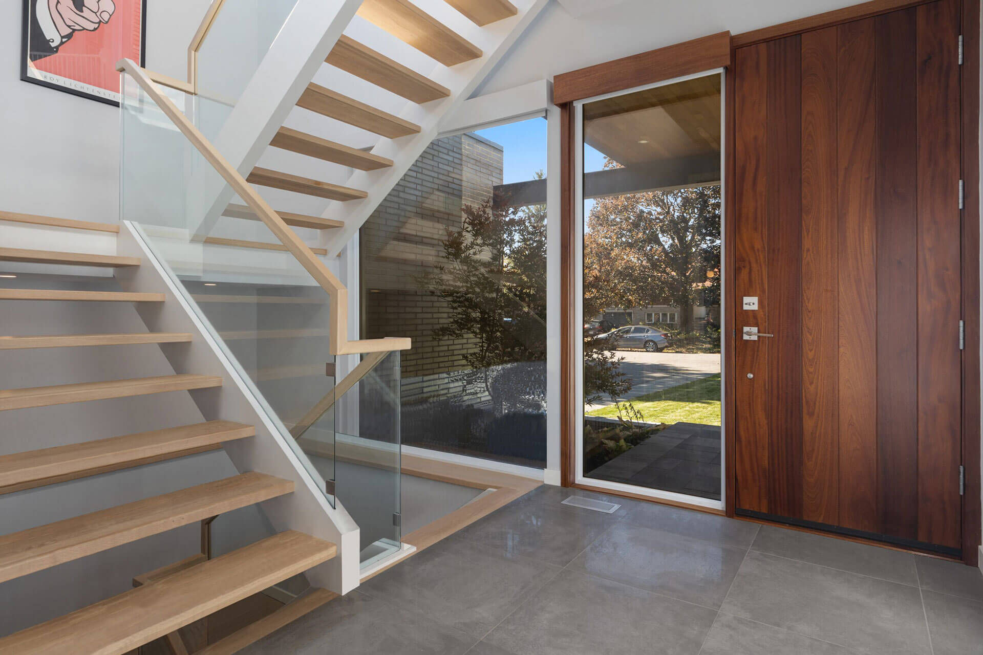 home interior with large window and wood door